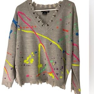 23. Paint splatter ripped cardigan